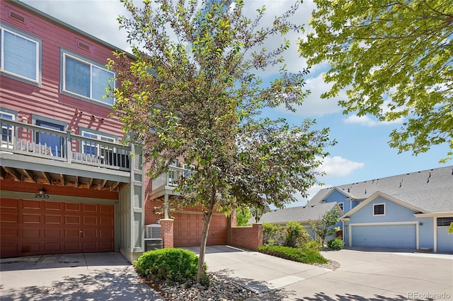 2933 Central Park Blvd, Denver, CO 80238 - townhome / multi-family property featuring driveway and brick siding