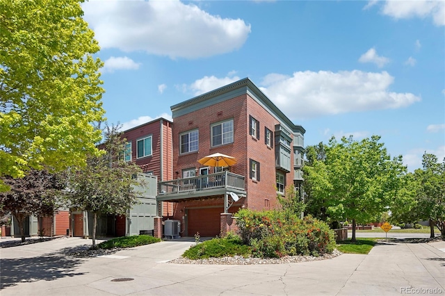 2933 Central Park Blvd, Denver, CO 80238 - view of property with central AC, driveway, and an attached garage