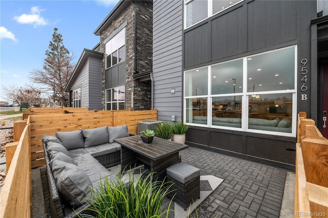 view of patio / terrace featuring central AC and an outdoor living space