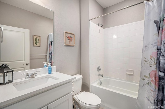 full bathroom with vanity, shower / tub combo with curtain, and toilet