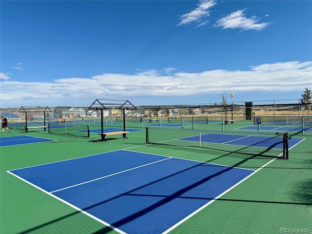 view of sport court with basketball hoop