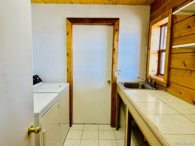 laundry room featuring sink, wooden ceiling, light tile patterned floors, and a wealth of natural light