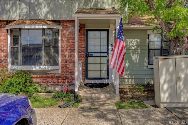 8144 Washington St Unit 192, Denver, CO 80229 - doorway to property with brick siding
