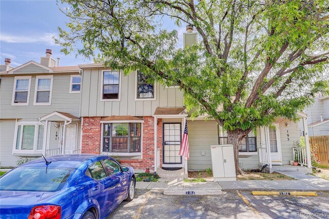 8144 Washington St Unit 192, Denver, CO 80229 - multi unit property featuring brick siding, board and batten siding, and uncovered parking