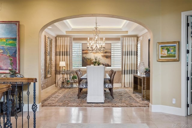 5335 E 2nd Ave, Denver, CO 80220 - dining area featuring a chandelier, arched walkways, crown molding, a raised ceiling, and tile patterned flooring