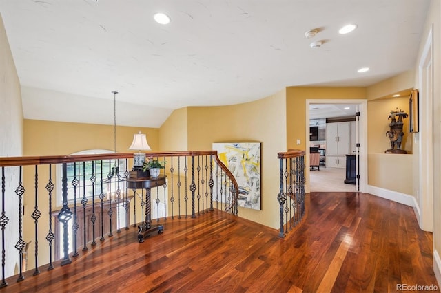 5335 E 2nd Ave, Denver, CO 80220 - hallway featuring wood finished floors, an upstairs landing, baseboards, and recessed lighting