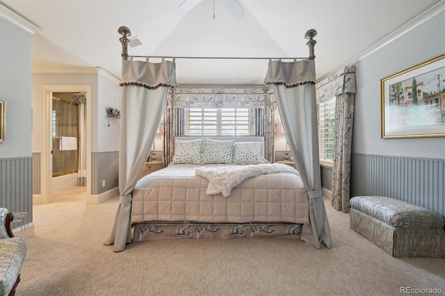 5335 E 2nd Ave, Denver, CO 80220 - carpeted bedroom with a wainscoted wall, crown molding, connected bathroom, and vaulted ceiling