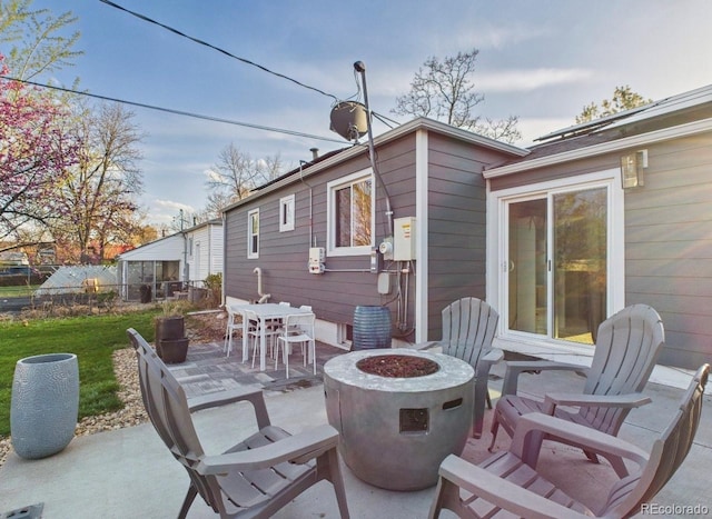 view of patio / terrace featuring outdoor dining space and a fire pit