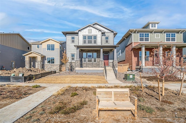 view of front of house featuring central AC unit and covered porch