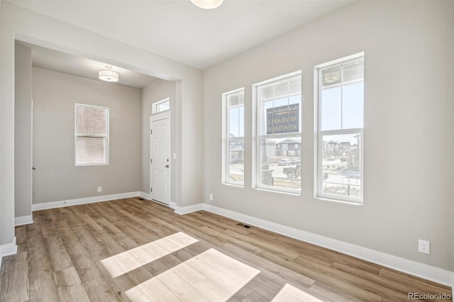 unfurnished room featuring light hardwood / wood-style floors