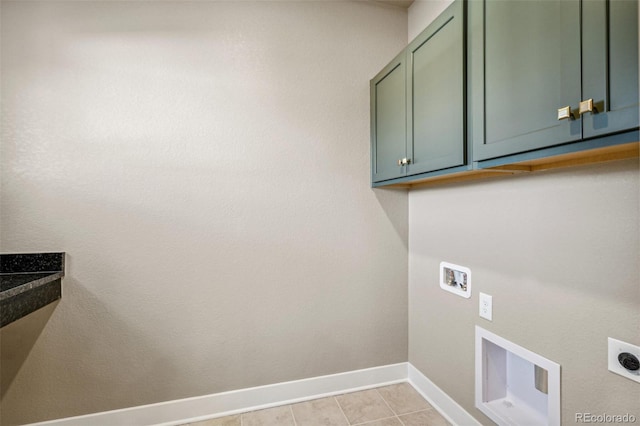 laundry room with washer hookup, electric dryer hookup, cabinets, and light tile patterned floors