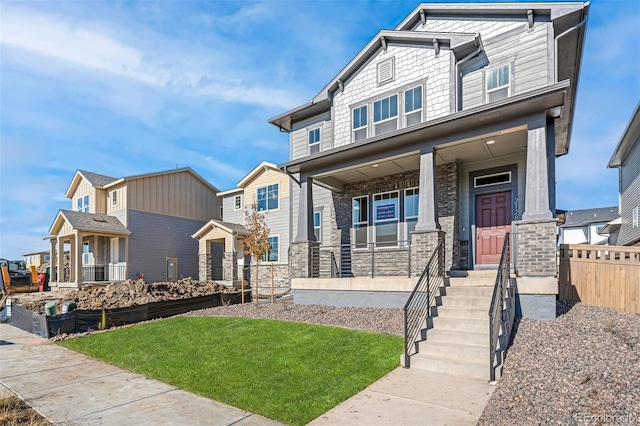 view of front of house featuring a front lawn and a porch