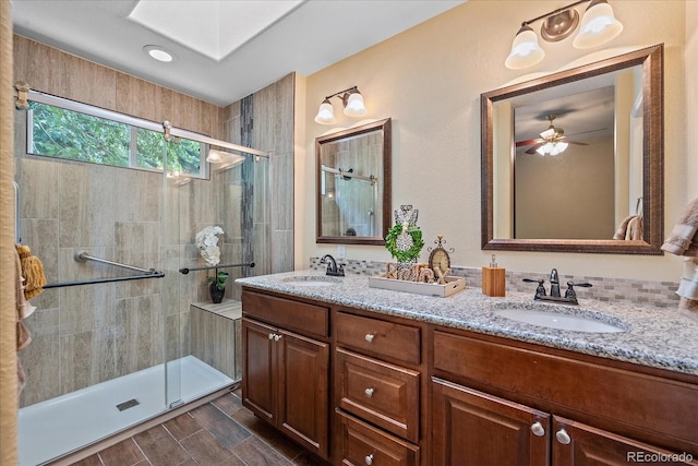 9406 Troon Village Way, Lone Tree, CO 80124 - bathroom featuring a stall shower, double vanity, and ceiling fan