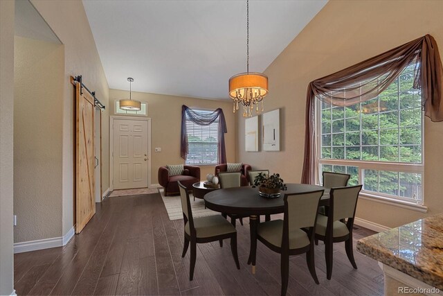 9406 Troon Village Way, Lone Tree, CO 80124 - dining room with a barn door, dark wood-type flooring, and a chandelier