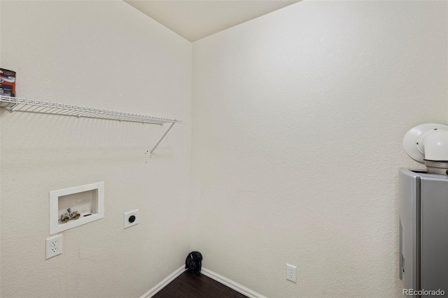 clothes washing area with laundry area, baseboards, wood finished floors, hookup for an electric dryer, and washer hookup