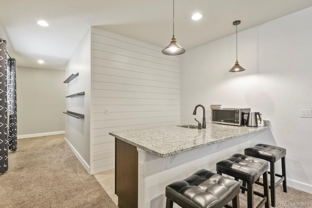 21376 E Union Pl, Aurora, CO 80015 - bar with a sink, stainless steel microwave, light carpet, baseboards, and recessed lighting