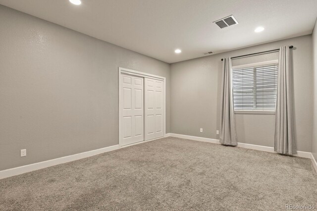 21376 E Union Pl, Aurora, CO 80015 - unfurnished bedroom featuring carpet flooring, recessed lighting, a closet, and baseboards