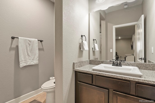 21376 E Union Pl, Aurora, CO 80015 - half bathroom with vanity, toilet, and tile patterned flooring