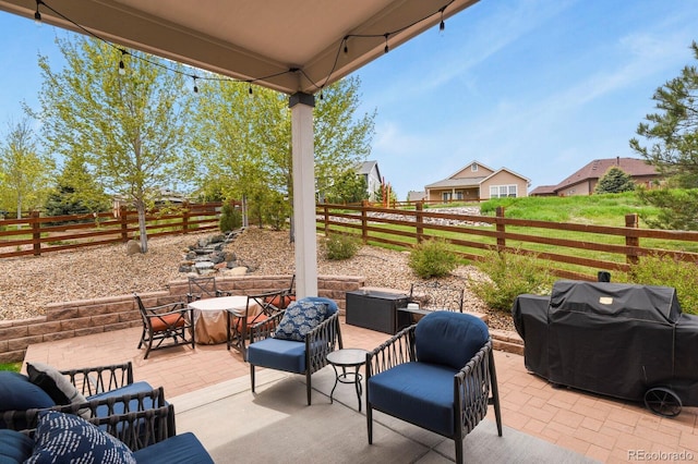 21376 E Union Pl, Aurora, CO 80015 - view of patio featuring area for grilling, a fenced backyard, and outdoor dining space