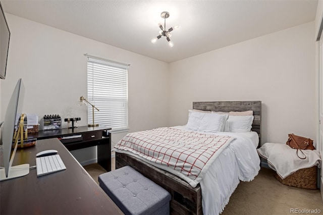 carpeted bedroom featuring a notable chandelier