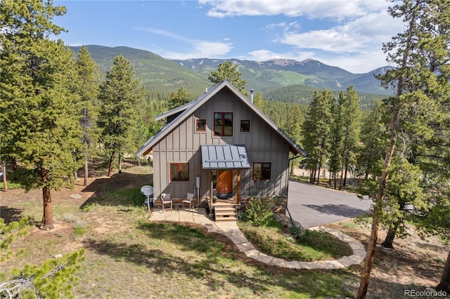 715 Clark Rd, Bailey, CO 80421 - view of front of house featuring a mountain view and board and batten siding