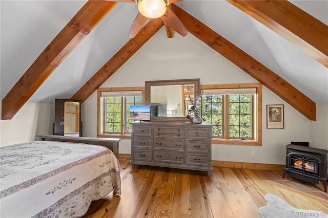 715 Clark Rd, Bailey, CO 80421 - bedroom featuring a wood stove and hardwood / wood-style flooring