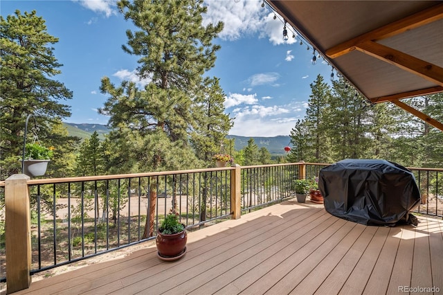 715 Clark Rd, Bailey, CO 80421 - wooden terrace with a mountain view and grilling area