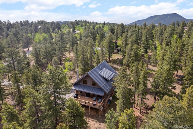 715 Clark Rd, Bailey, CO 80421 - aerial view of property and surrounding area with a heavily wooded area and mountains