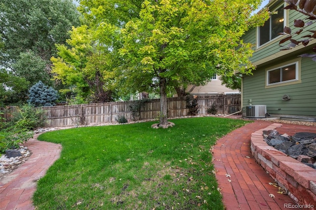 view of yard with central AC