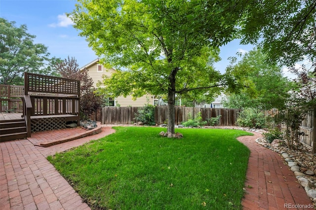 view of yard with a deck