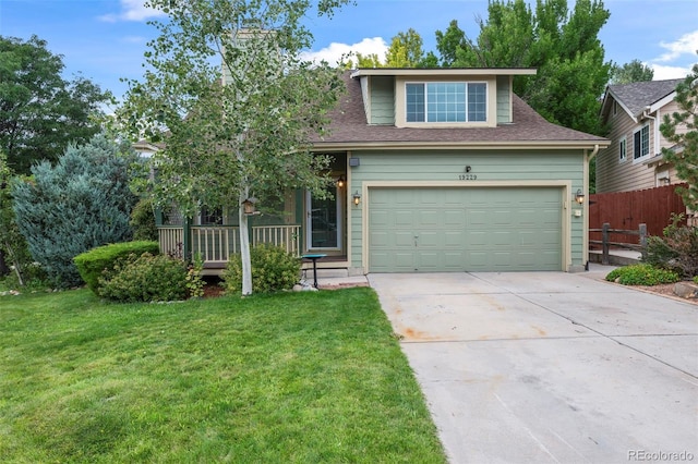 view of front facade with a garage and a front lawn