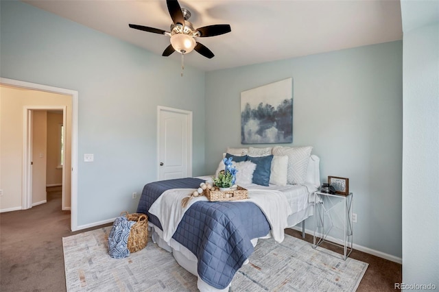 bedroom featuring vaulted ceiling, ceiling fan, and carpet floors