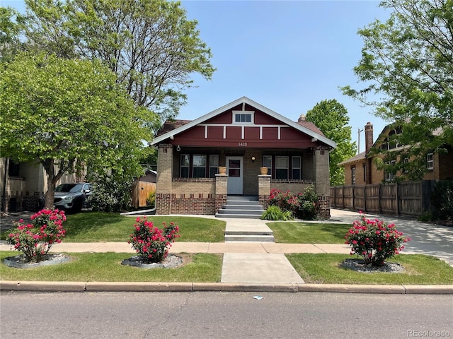 1418 Perry St, Denver, CO 80204 - view of front of house with a porch and brick siding