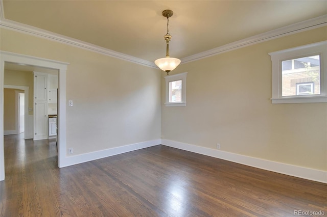 empty room with crown molding, baseboards, and dark wood-style flooring