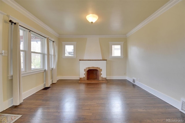 unfurnished living room featuring a large fireplace, crown molding, dark wood finished floors, and baseboards