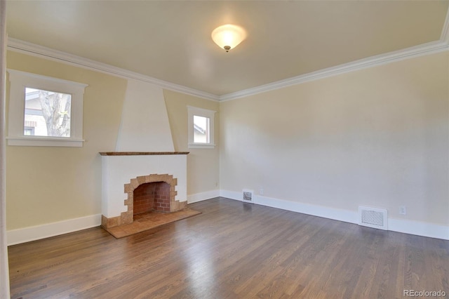 unfurnished living room featuring crown molding, dark wood-style flooring, baseboards, and a brick fireplace