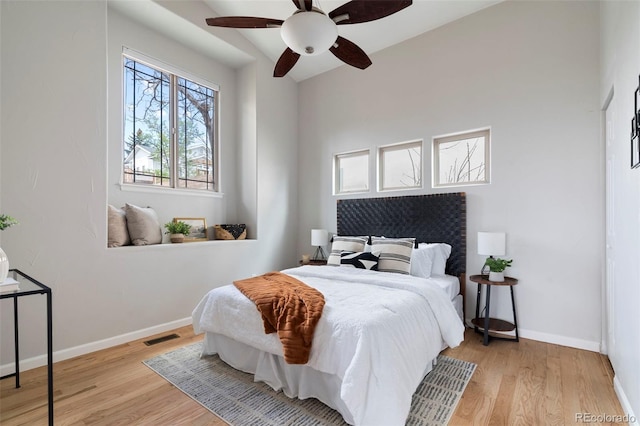 415 Butte Pkwy, Golden, CO 80403 - bedroom with wood finished floors, baseboards, and ceiling fan
