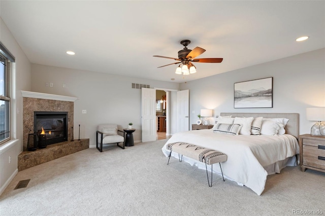 415 Butte Pkwy, Golden, CO 80403 - bedroom featuring light carpet, a premium fireplace, a ceiling fan, recessed lighting, and baseboards