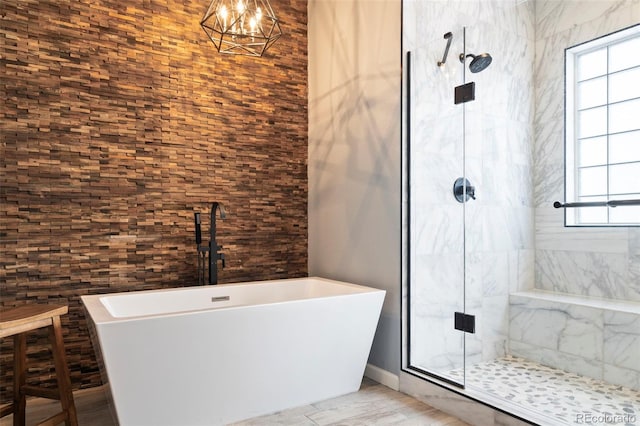 415 Butte Pkwy, Golden, CO 80403 - bathroom featuring a freestanding tub, a stall shower, and a chandelier