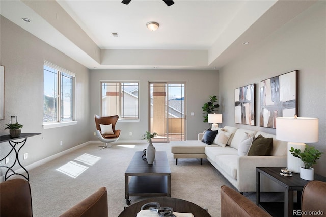 415 Butte Pkwy, Golden, CO 80403 - living room featuring carpet floors, baseboards, a ceiling fan, and a tray ceiling