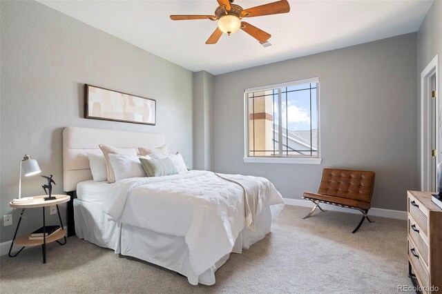 415 Butte Pkwy, Golden, CO 80403 - bedroom with light colored carpet, baseboards, and a ceiling fan
