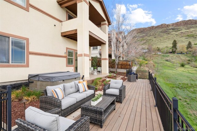 415 Butte Pkwy, Golden, CO 80403 - wooden terrace featuring an outdoor hangout area, a hot tub, and a mountain view