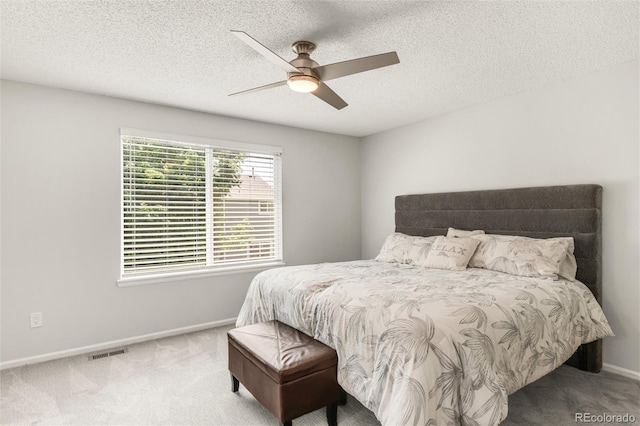 10591 Hyacinth St, Highlands Ranch, CO 80129 - carpeted bedroom with baseboards, a textured ceiling, and a ceiling fan