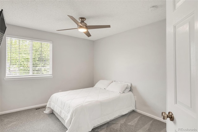 10591 Hyacinth St, Highlands Ranch, CO 80129 - bedroom featuring carpet, baseboards, ceiling fan, and a textured ceiling