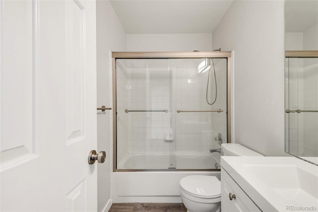 10591 Hyacinth St, Highlands Ranch, CO 80129 - bathroom featuring toilet, vanity, and enclosed tub / shower combo