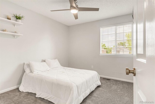 10591 Hyacinth St, Highlands Ranch, CO 80129 - carpeted bedroom featuring baseboards, a ceiling fan, and a textured ceiling