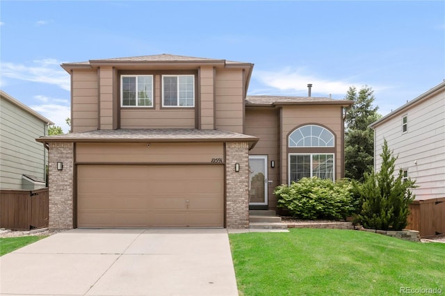 10591 Hyacinth St, Highlands Ranch, CO 80129 - traditional home featuring an attached garage, driveway, brick siding, and a shingled roof