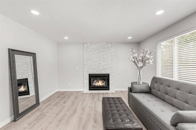 10591 Hyacinth St, Highlands Ranch, CO 80129 - living area featuring a fireplace, light wood-type flooring, and recessed lighting