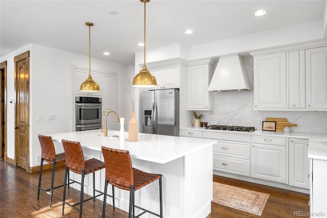 kitchen with stainless steel appliances, dark wood-type flooring, white cabinets, and custom range hood