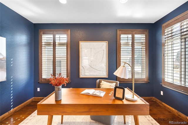 office area with baseboards and wood finished floors